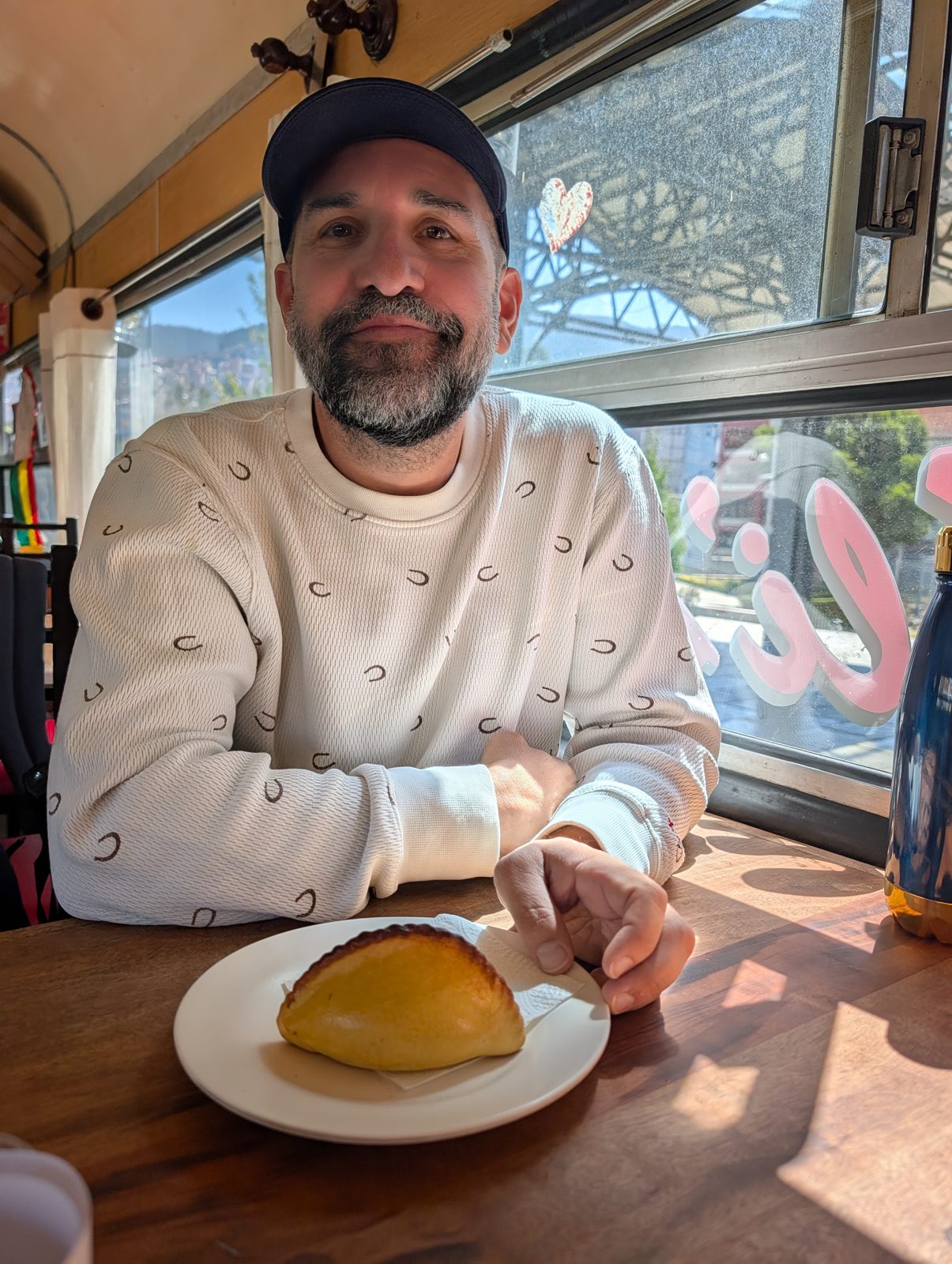 Juan and the salteña: Bolivia's most popular food, an empanada's cousin filled with meat and broth. Bolivians eat them before noon without spilling. Juan managed the first part.