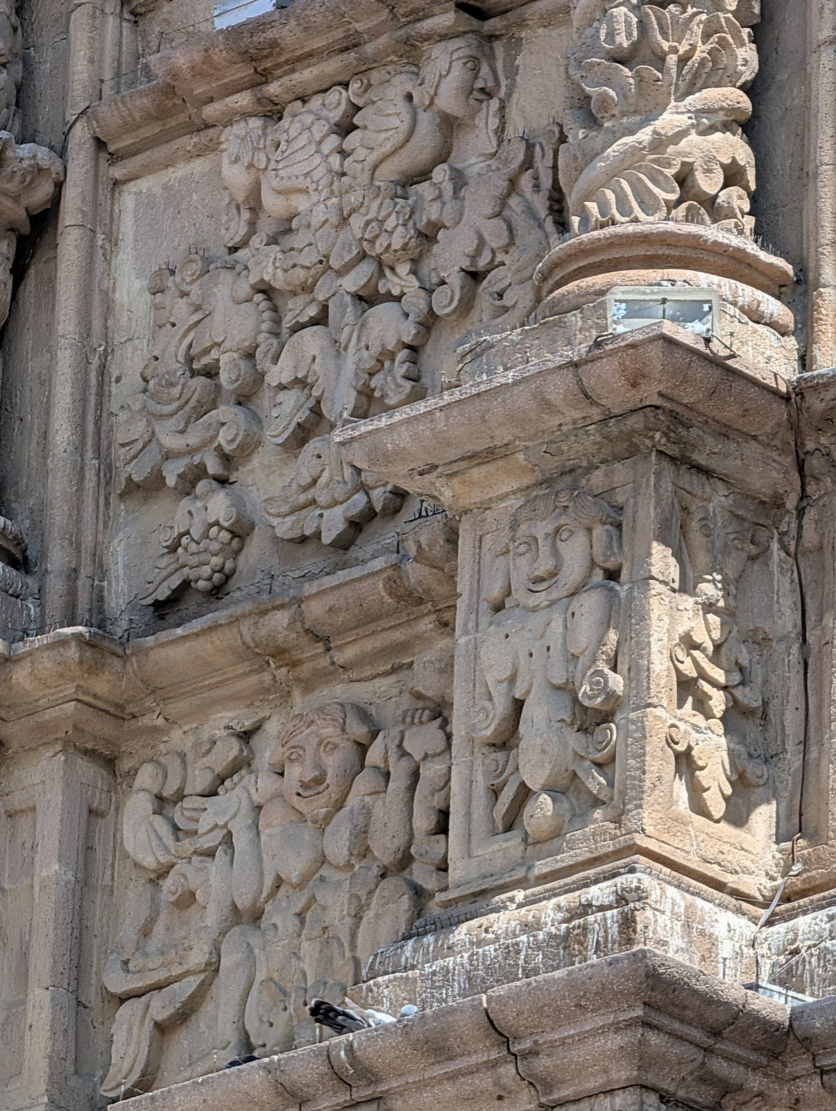 The front of San Francisco, carved in the 1700s by Aymara masons who worked their own birds and fruit into the Spanish plan.