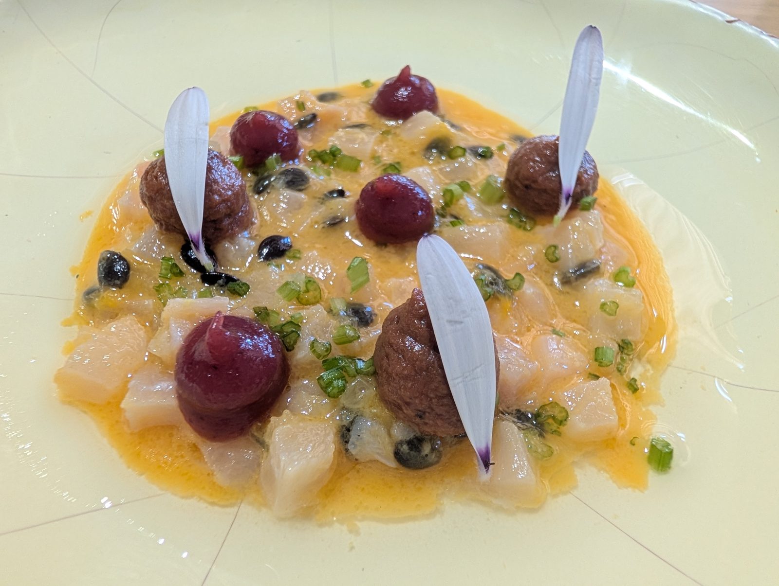 Ceviche with purple potato and bitter leaves.