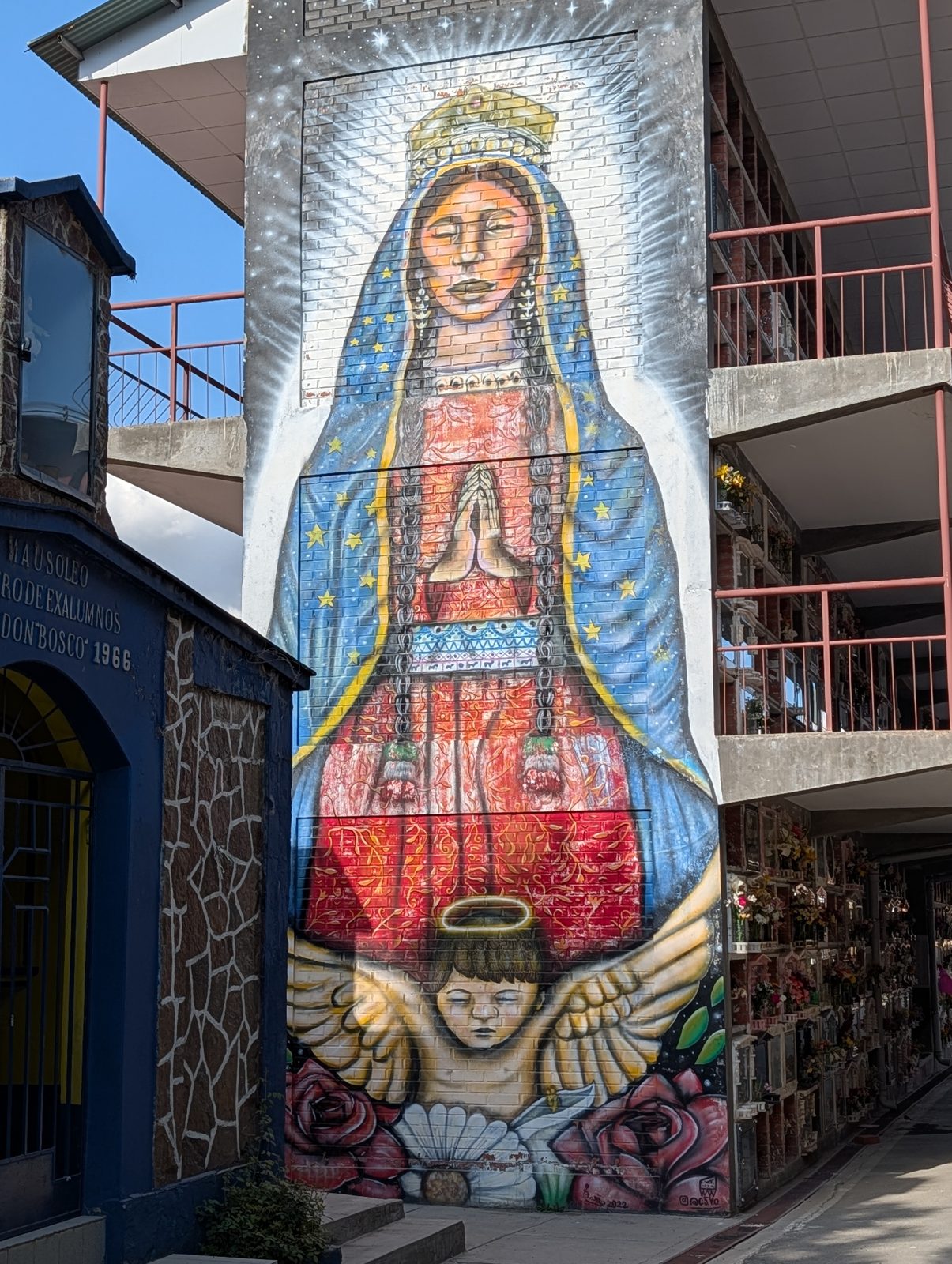A Virgin, three stories tall, on a niche block.