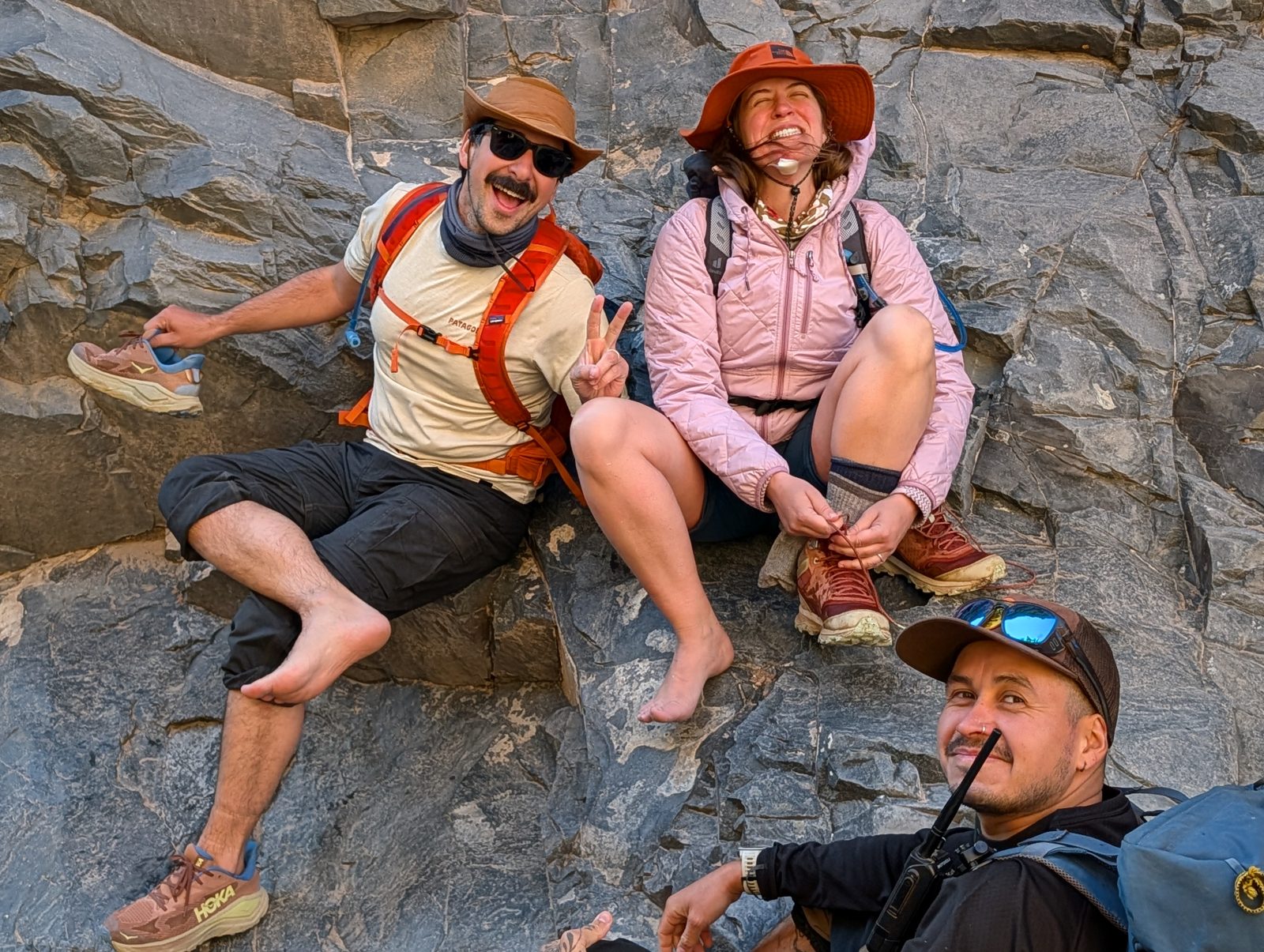 Boots off at the river: Juan, Luna and Rodrigo.