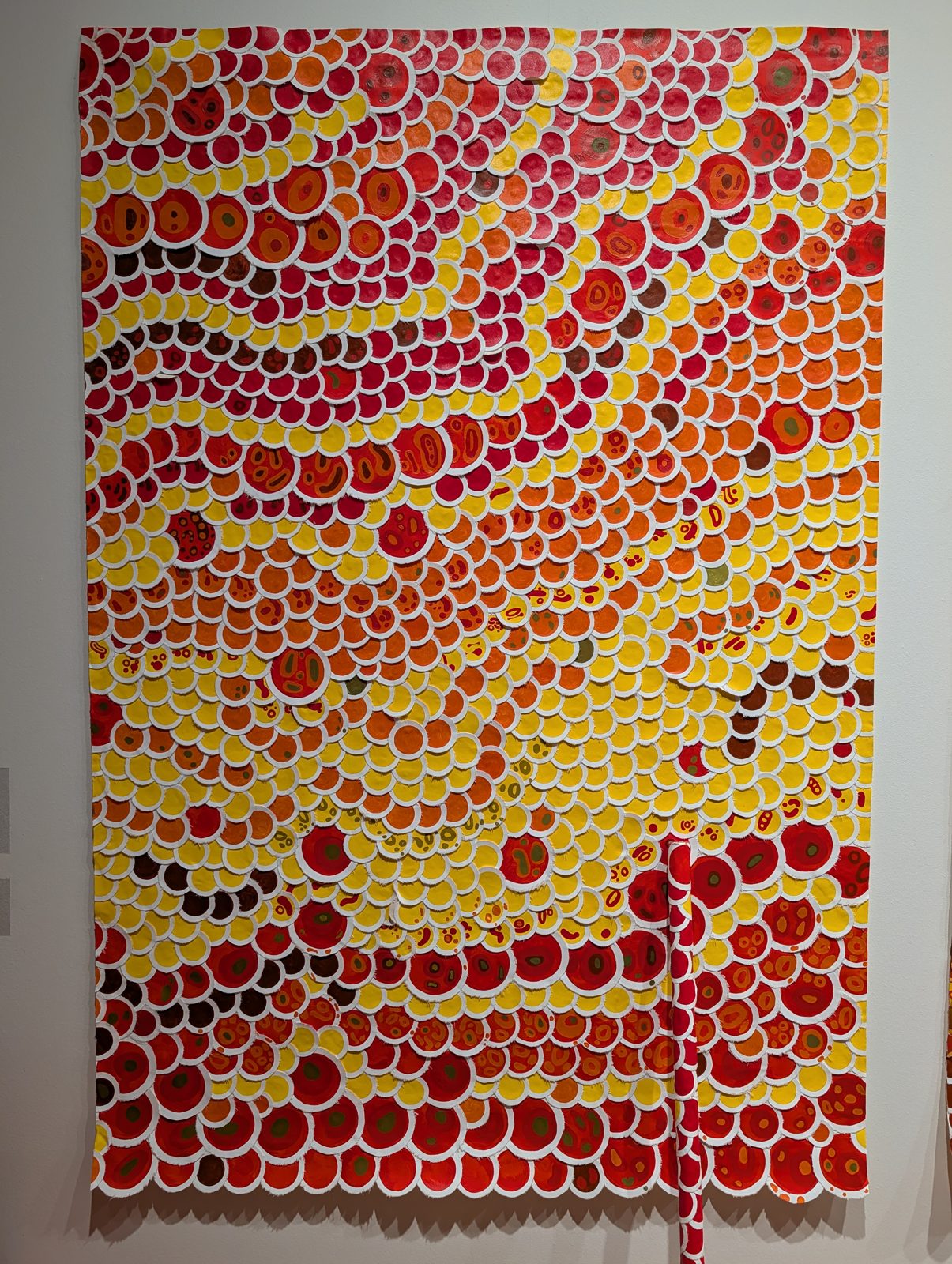 The same piece, in color: thousands of painted discs.
