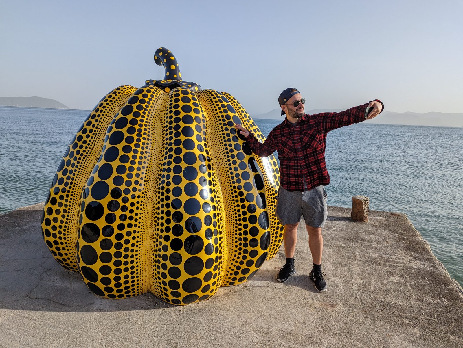 Ari with Kusama's yellow pumpkin, on its pier.